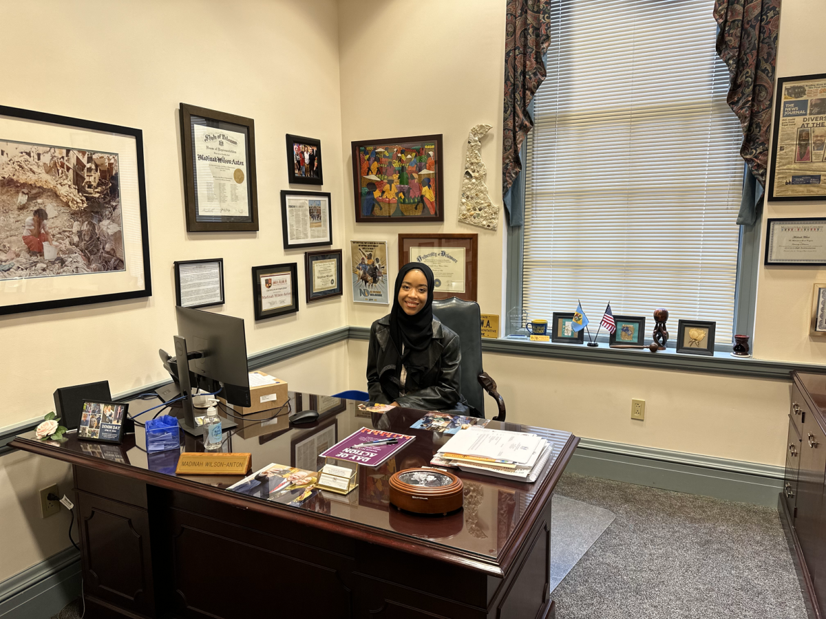 Representative Madinah Wilson-Anton sits at her desk in her office at Legislative Hall, Dover.